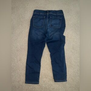 (1) Pair of blue jeans with two buttons and a zipper.